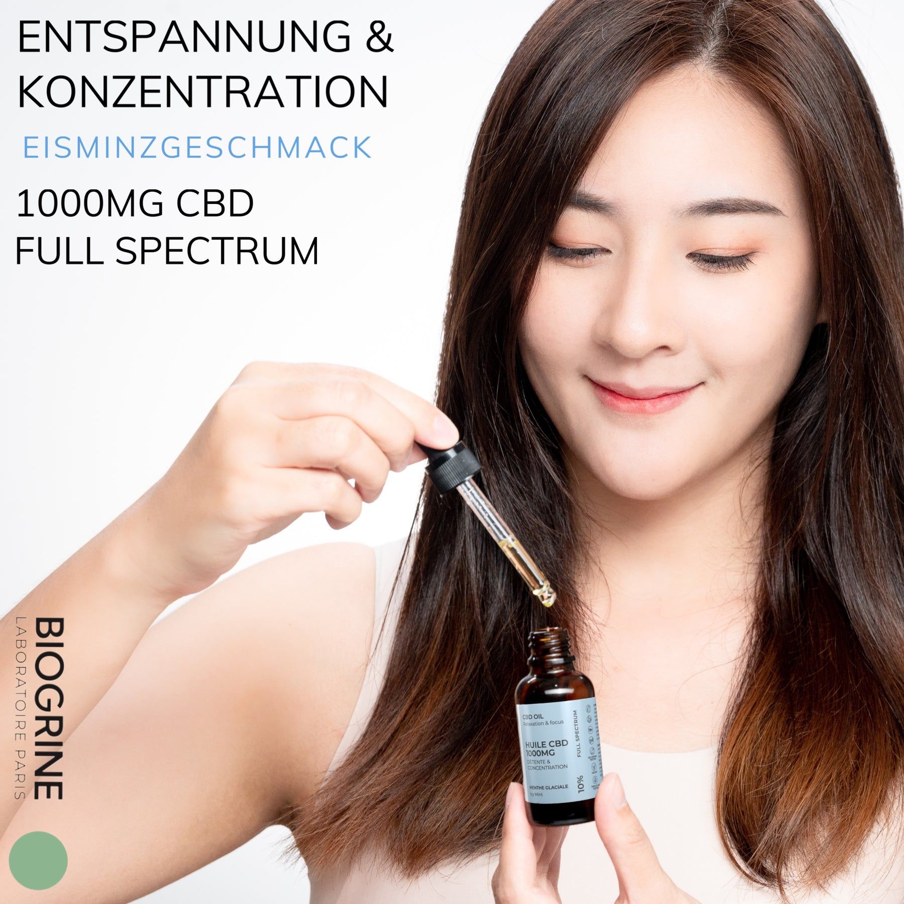 Donna con flacone di olio CBD e pipetta. Scritta: 1000mg CBD, Full Spectrum. Marchio: BIOGRINE.