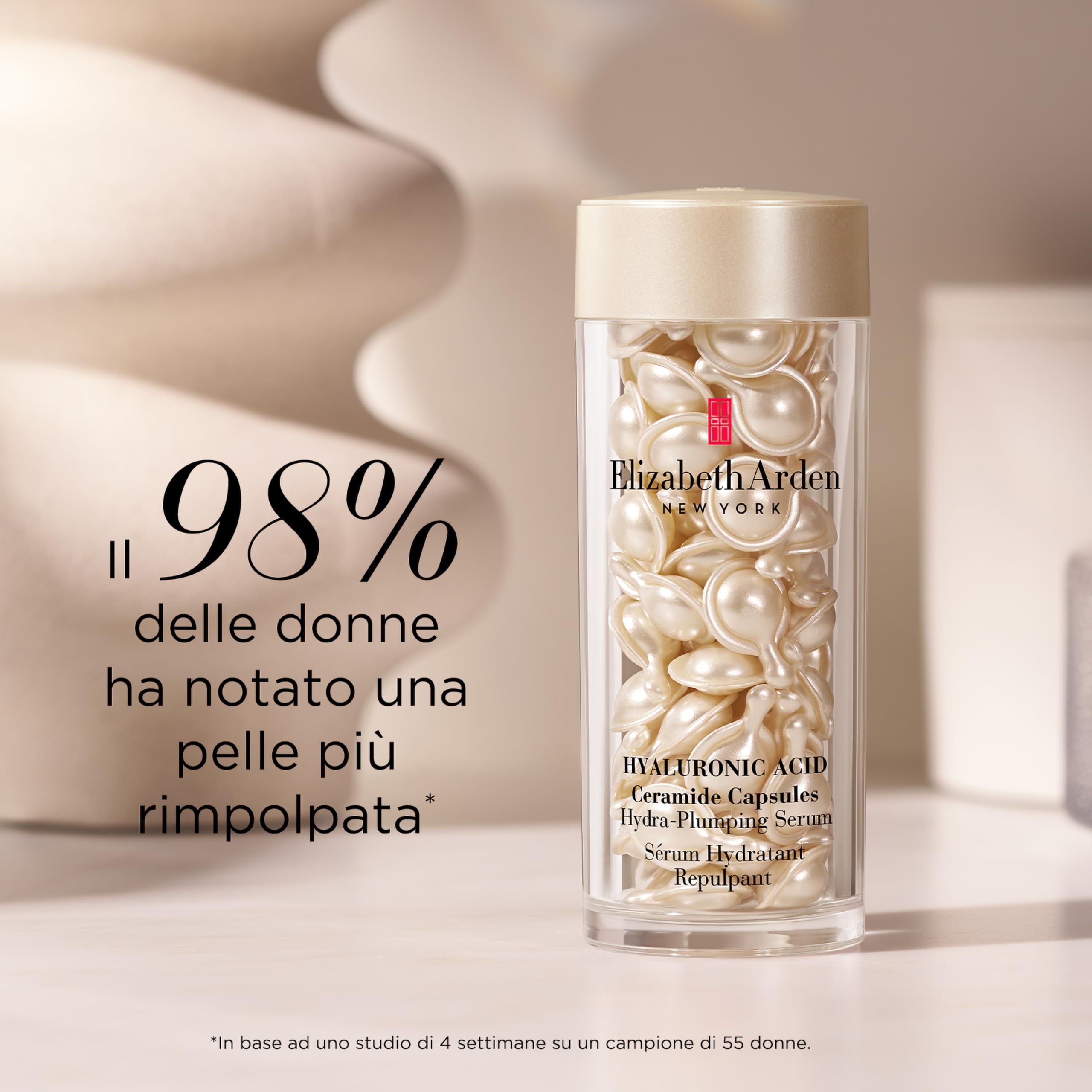 Flacone trasparente di capsule. Testo: Elizabeth Arden, capsule di ceramidi all'acido ialuronico. Testo: Il 98% delle donne...