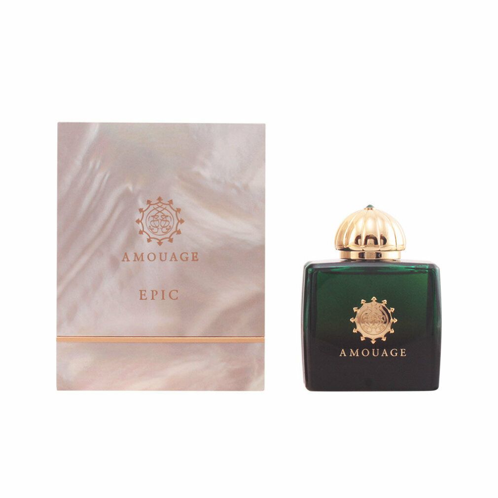 Profumo verde accanto a una confezione. Scritta AMOUAGE EPIC. Dettagli dorati.