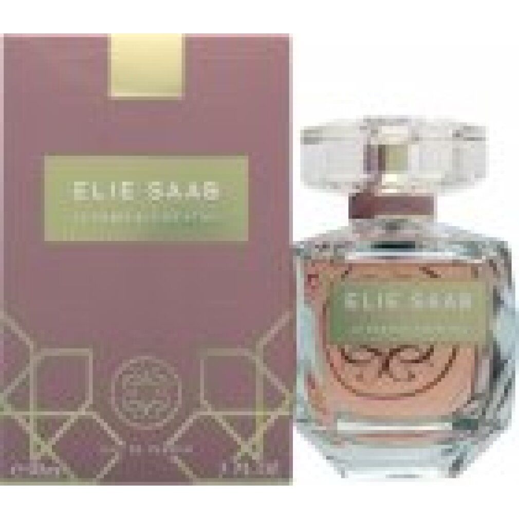 Flacone di profumo e confezione. Flacone rosa. Etichetta dorata. Confezione rosa.