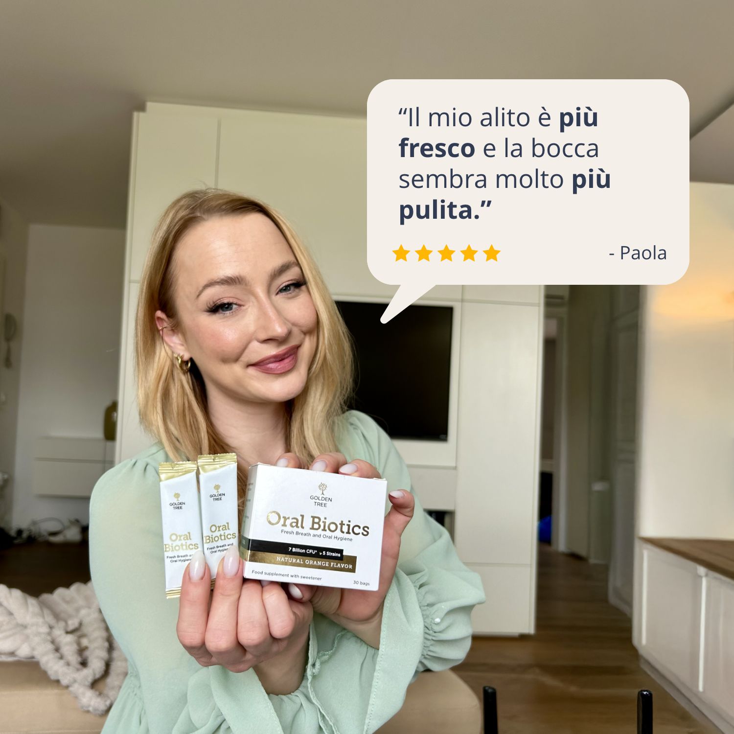 Donna con Golden Tree Oral Biotics. Citazione: 'Il mio alito è più fresco e la bocca sembra molto più pulita.'