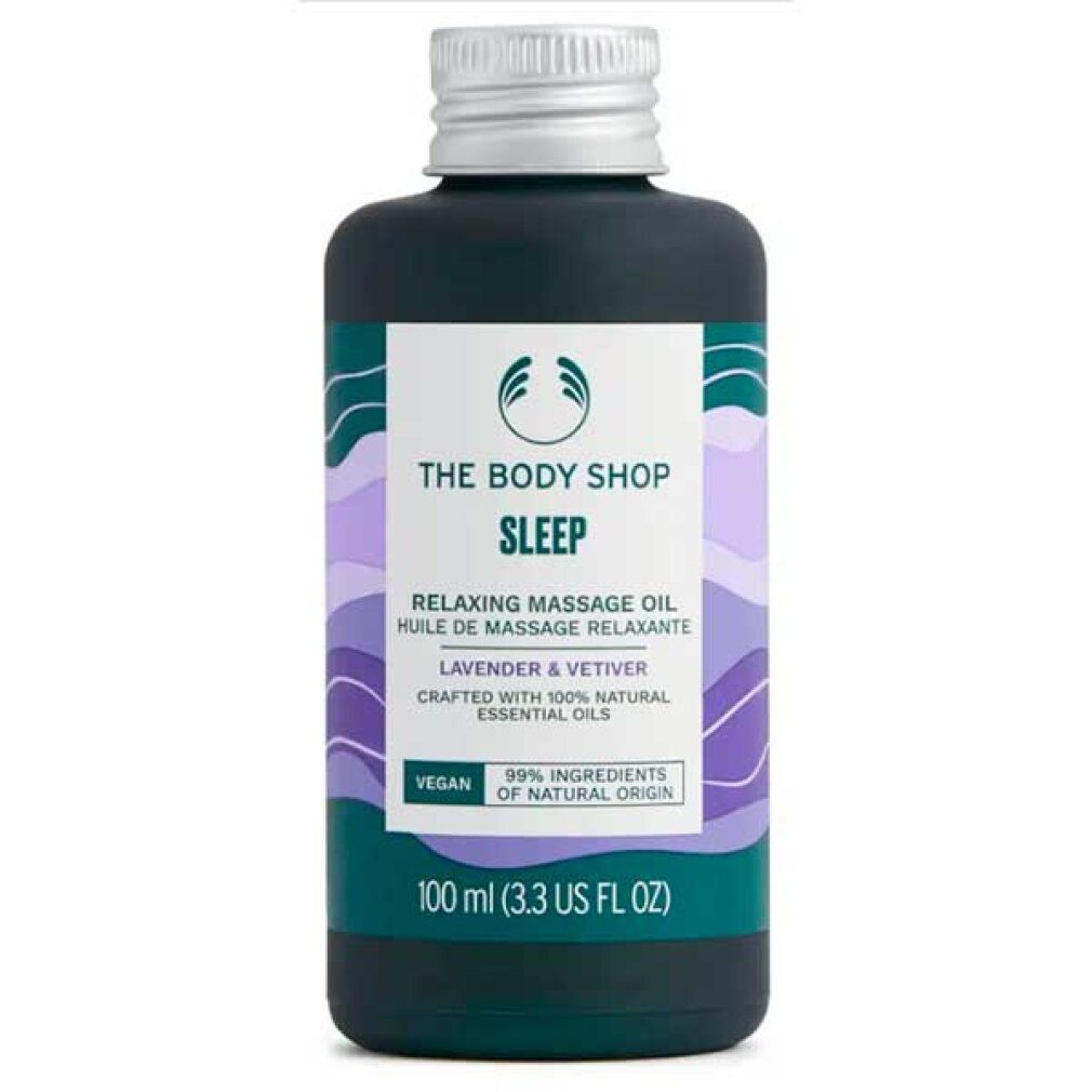 Flacone verde scuro con tappo argentato. Etichetta con testo: The Body Shop Sleep Relaxing Massage Oil. Vegano. 99% ingredienti naturali.