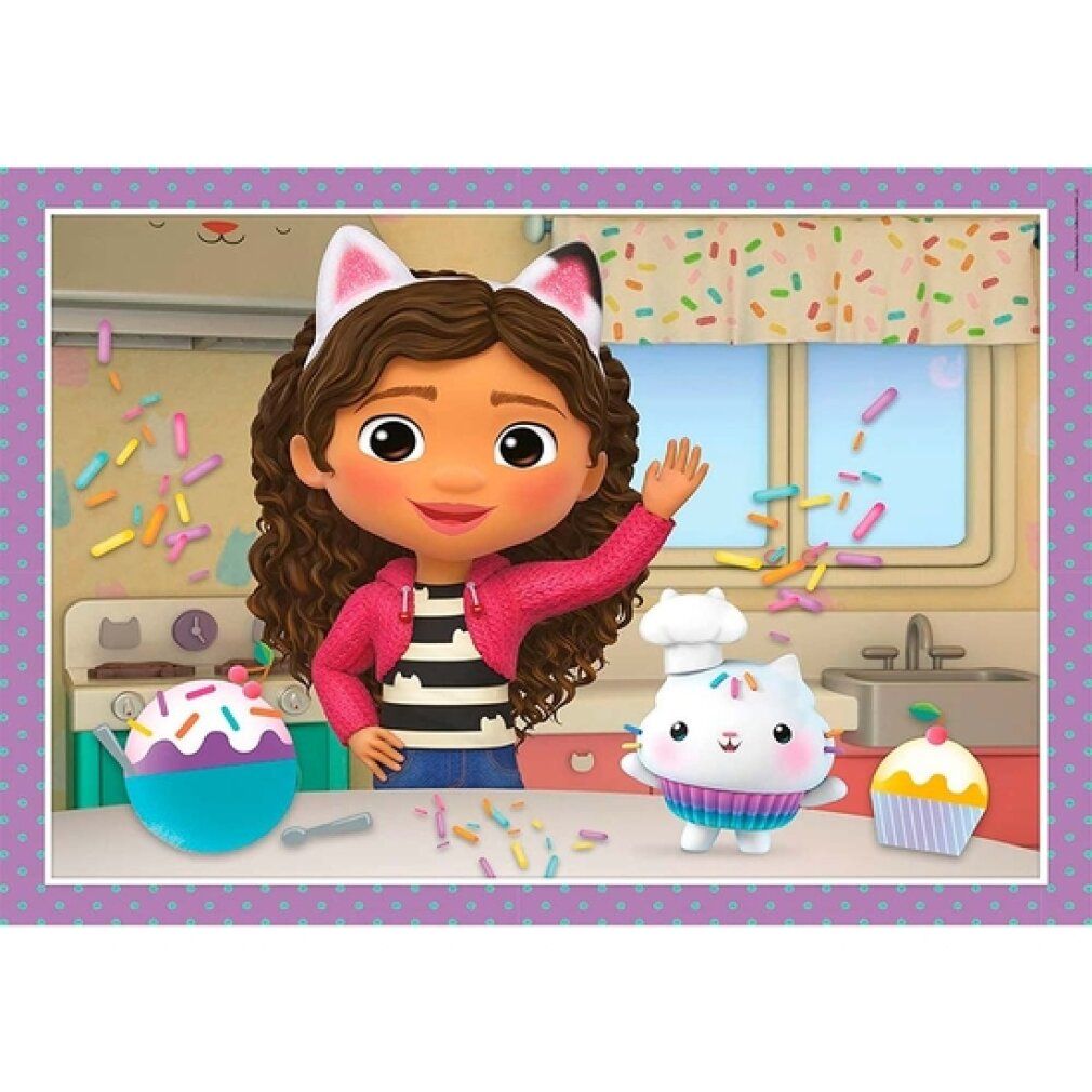 Puzzle con Gabby che saluta e due personaggi gatto. Sfondo: cucina con zuccherini e cupcake.