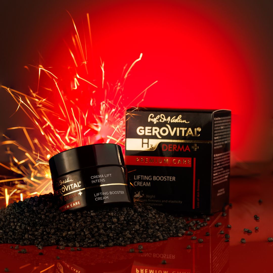 Vaso nero e scatola. Scritta: Gerovital H3 Derma+, Premium Care, Crema Lift Intens, Lifting Booster Cream. Sfondo rosso.
