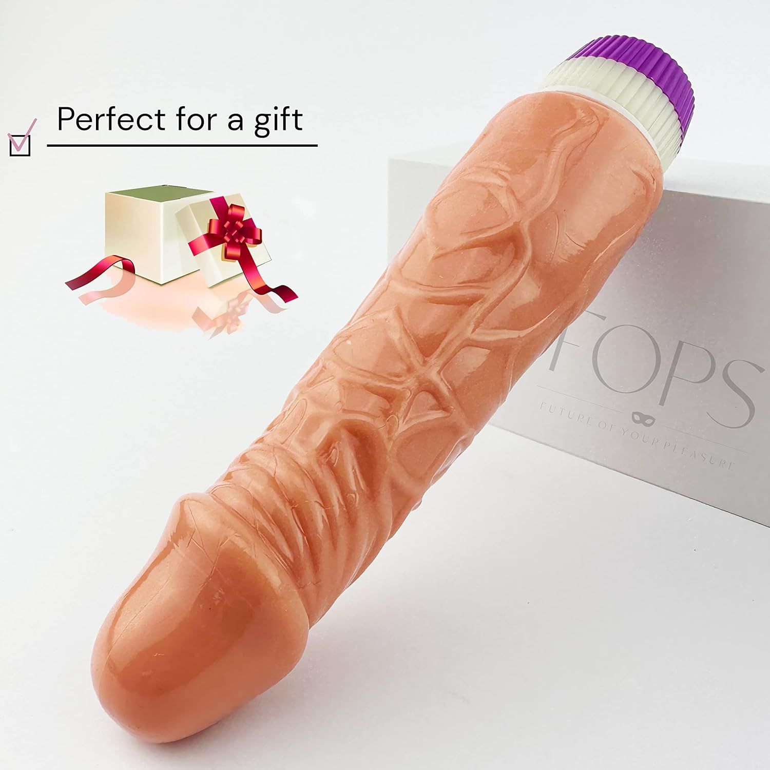 Dildo beige con texture realistica. Estremità viola e bianca. Testo: Perfect for a gift. Confezione.