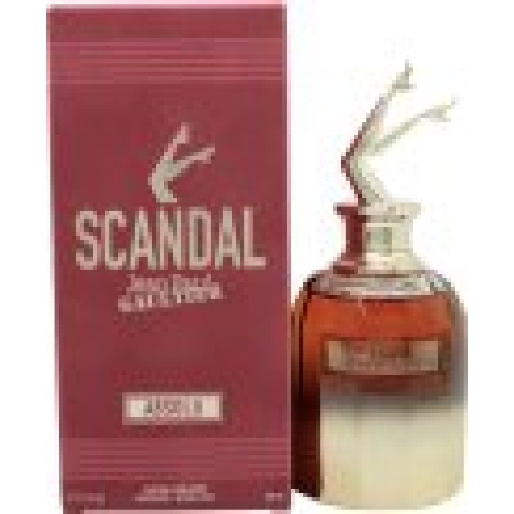 Flacone di profumo con gambe argentate come tappo. Accanto, scatola rossa con scritta dorata "SCANDAL".