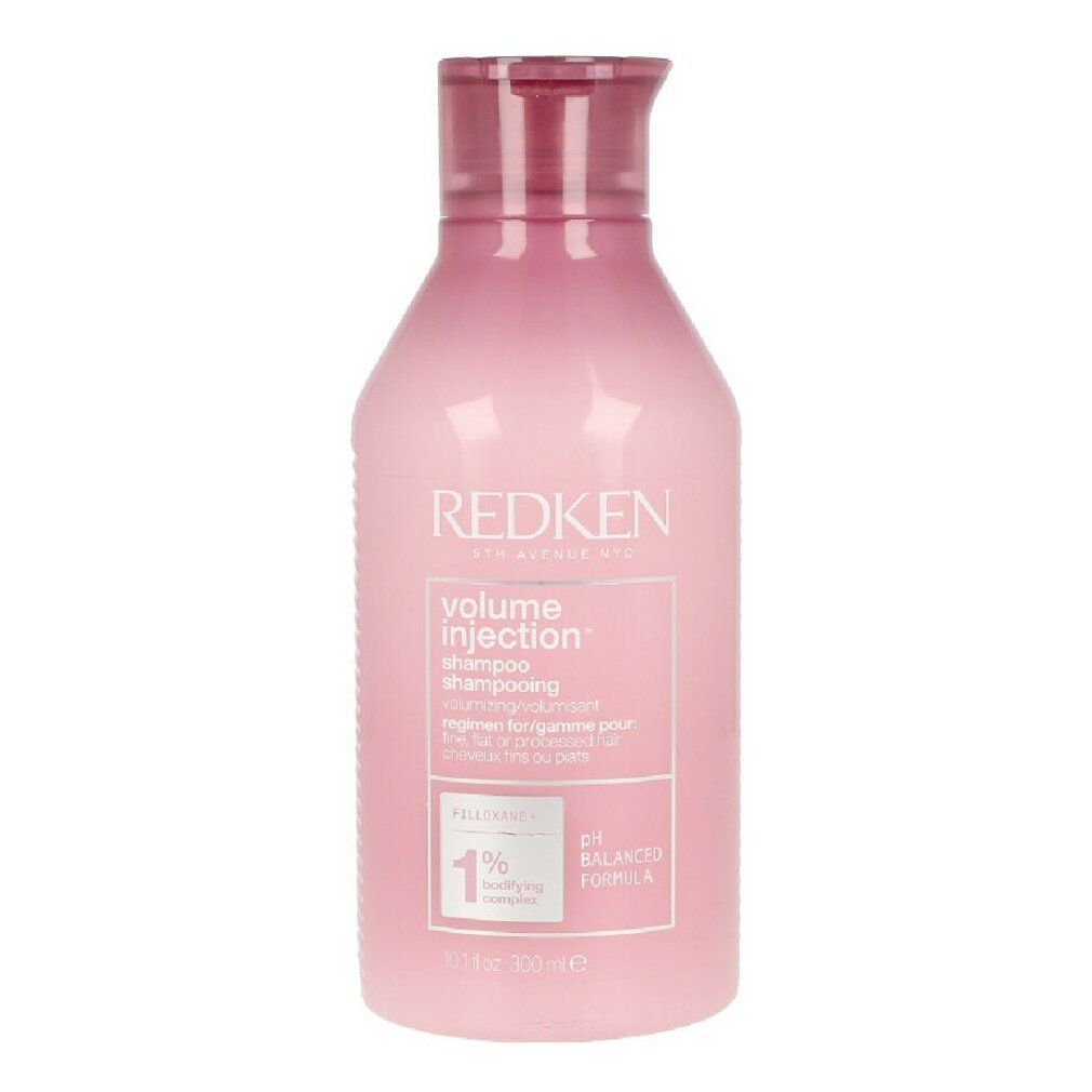 Flacone di shampoo rosa con testo bianco. Marchio: Redken. Nome prodotto: Volume Injection Shampoo. Formula pH bilanciata.