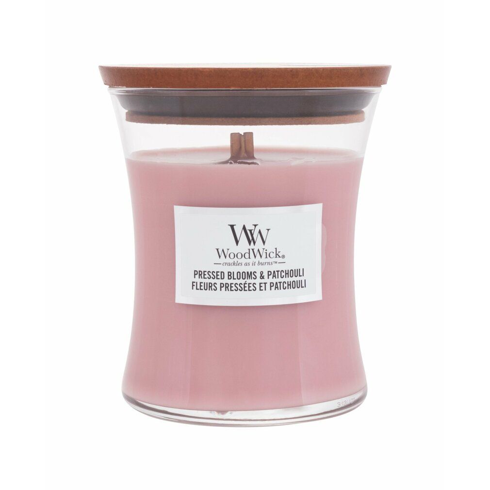 Candela rosa in contenitore di vetro con stoppino in legno e coperchio. Etichetta con nome e logo.