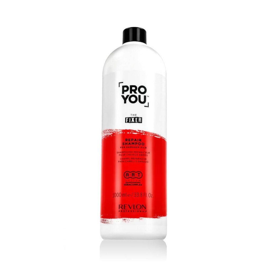 Flacone bianco, tappo nero. Scritta: Pro You The Fixer Repair Shampoo. Area rossa. Revlon Professional.