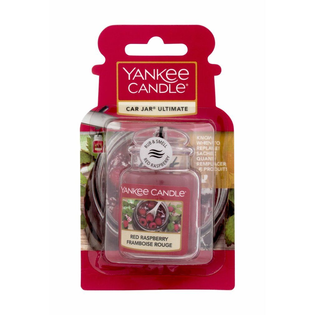 Ultimate Car Jar, profumo per auto. Vasetto rosso con coperchio, etichetta con lamponi. Confezione con foro per appendere. Testo: Yankee Candle, Red Raspberry.