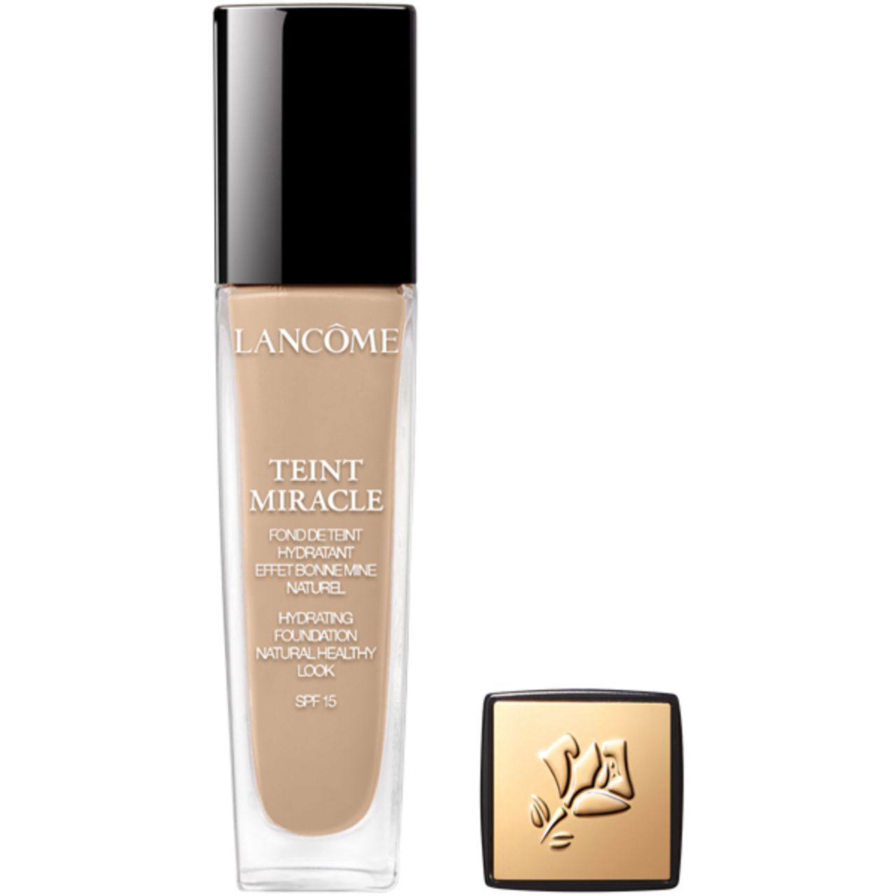 Fondotinta liquido in bottiglia di vetro con tappo nero. Accanto, tappo con logo. Scritta: Lancôme, Teint Miracle, SPF 15.