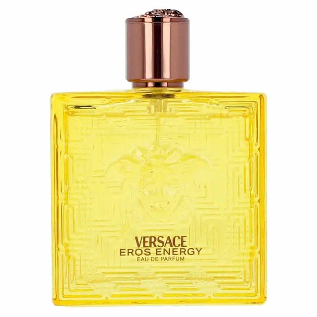 Flacone giallo Versace Eros Energy EdP. Forma quadrata, logo Medusa in rilievo e motivo geometrico. Tappo marrone.
