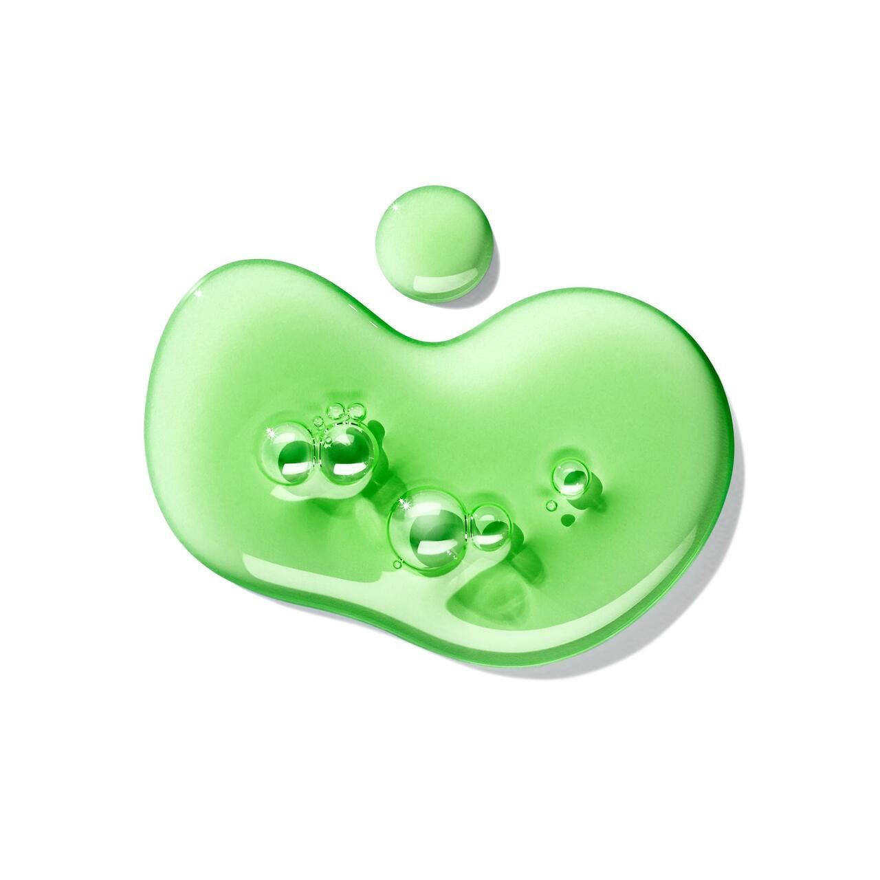 Gel verde con bolle su sfondo bianco. Una goccia più grande e una più piccola.