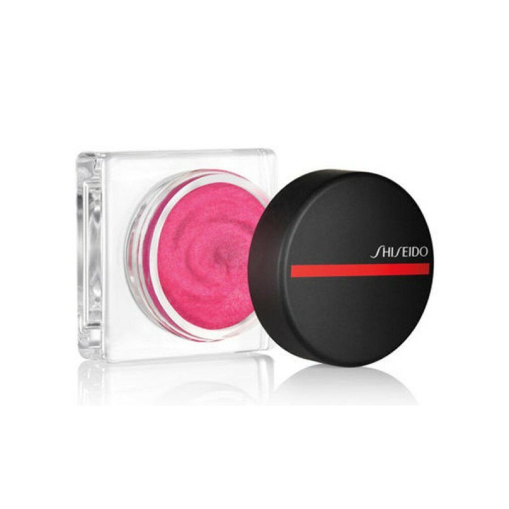 Coperchio nero rotondo con linea rossa e scritta SHISEIDO. Accanto, contenitore quadrato aperto con prodotto rosa.
