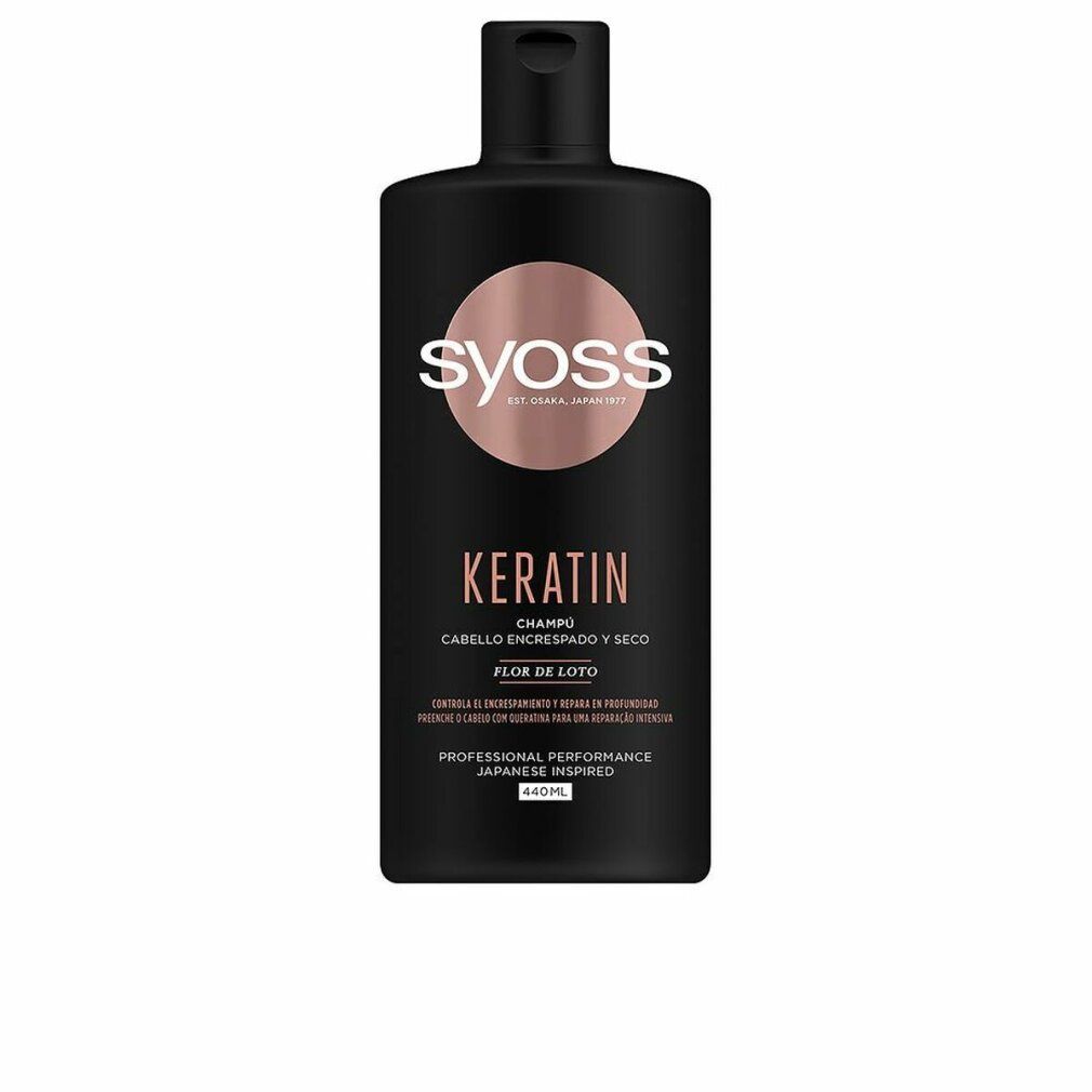 Flacone di shampoo nero con logo rosa. Scritte: Syoss, Keratin, Cabello Encrespado y Seco, Flor de Loto. Professional Performance, Japanese Inspired. 600ml.