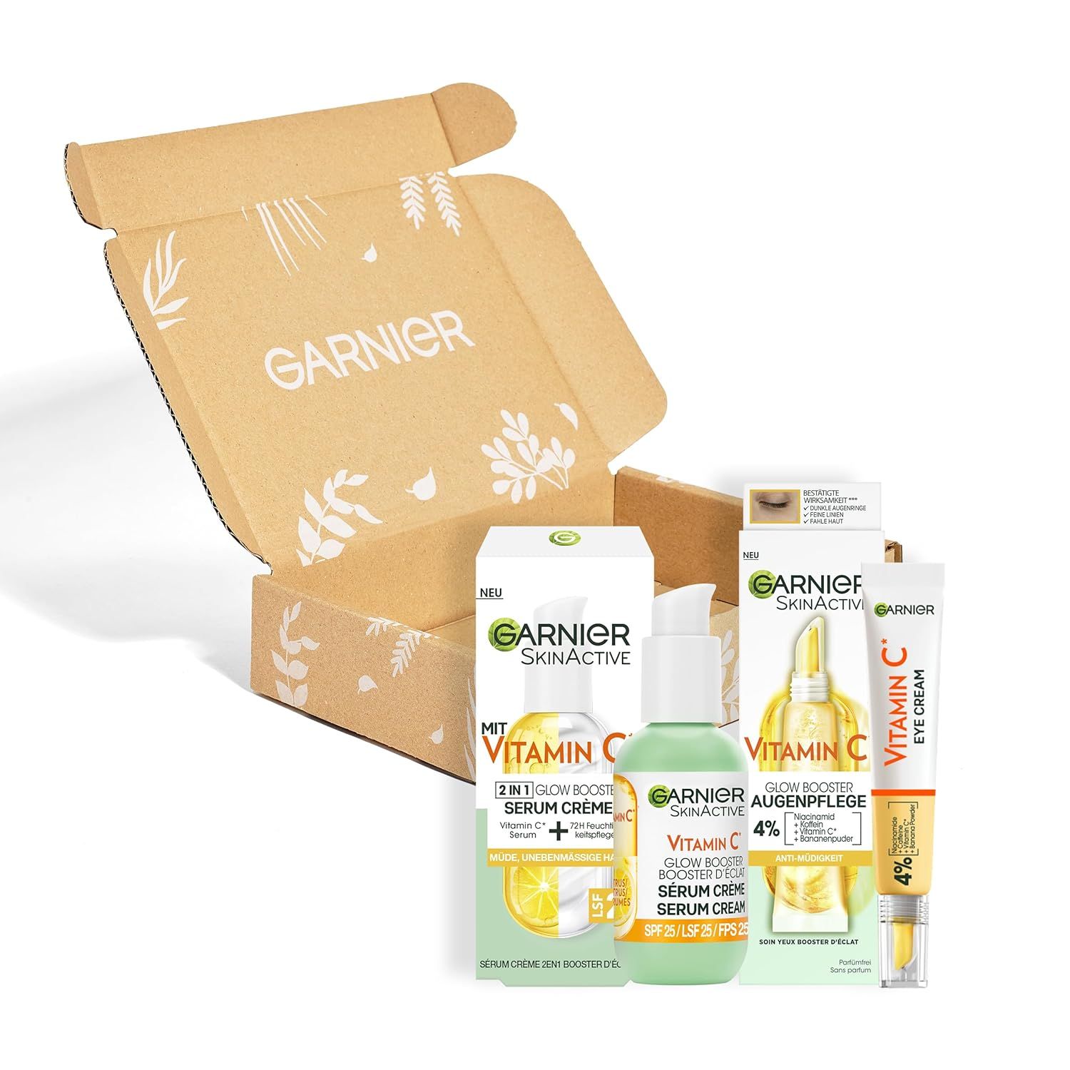 Garnier Vitamin C Glow Booster Set in scatola di cartone marrone. Contiene crema siero, siero e crema occhi.