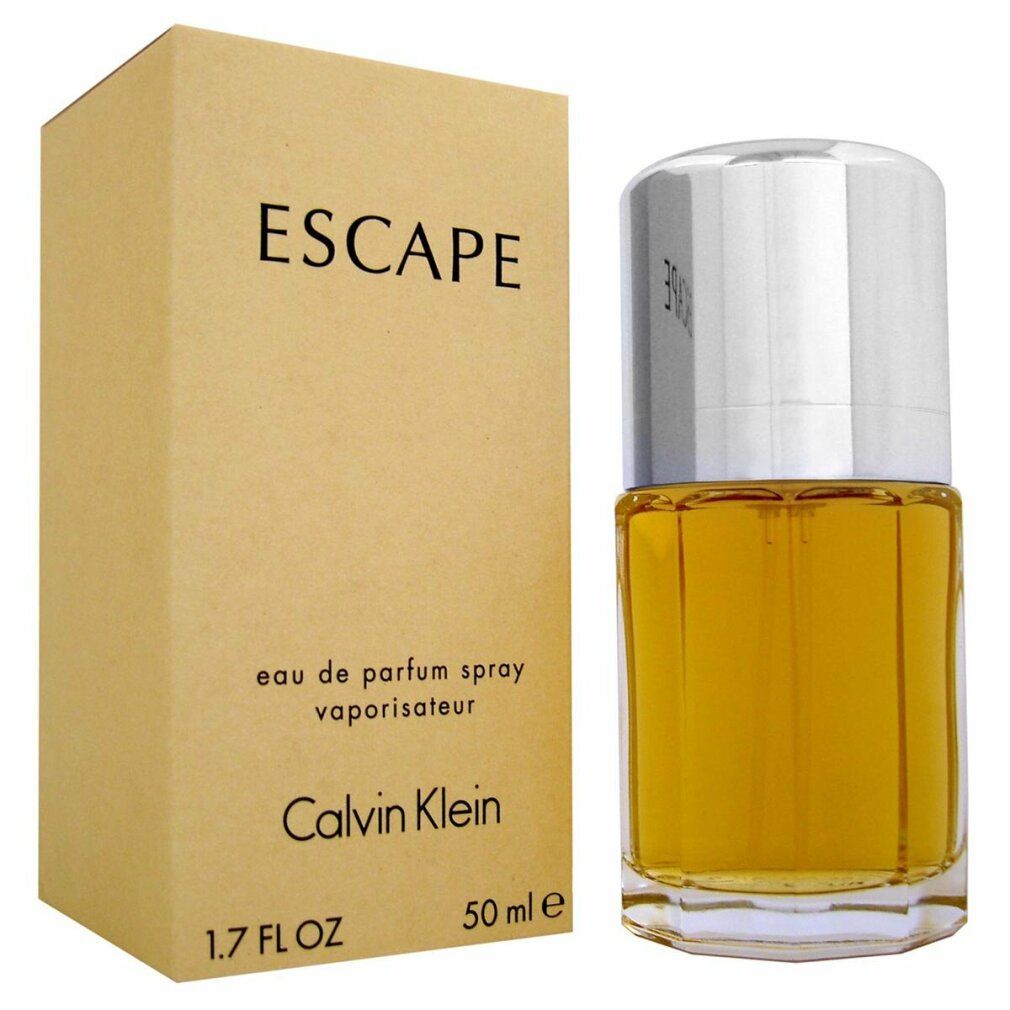 Flacone di profumo e confezione. Scritta: ESCAPE, Calvin Klein. Flacone con tappo argentato, liquido dorato. 1.7 FL OZ, 50 ml.