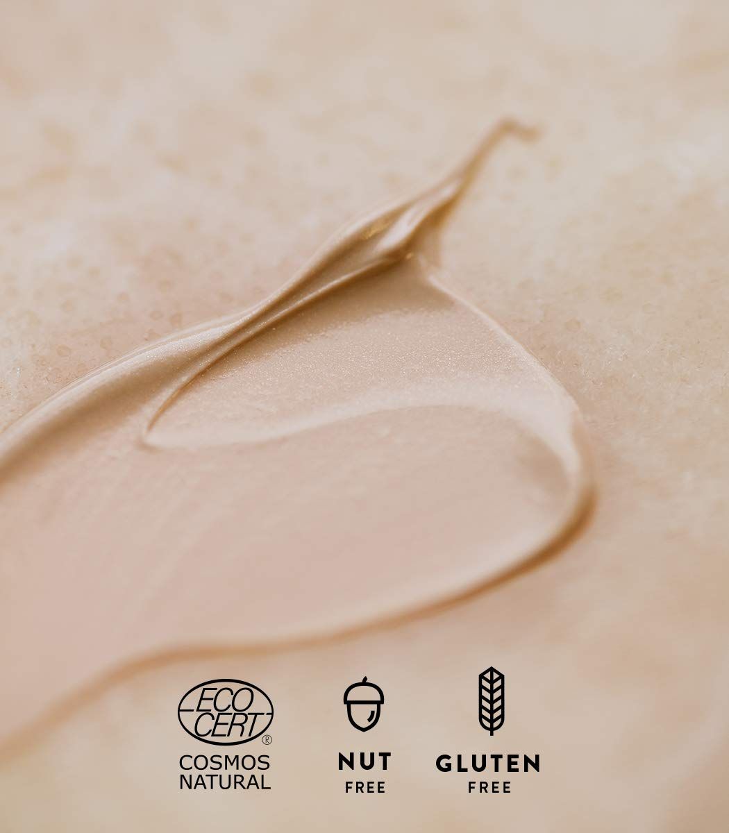 Primo piano di una crema. Loghi: Cosmos Natural, Nut Free, Gluten Free.