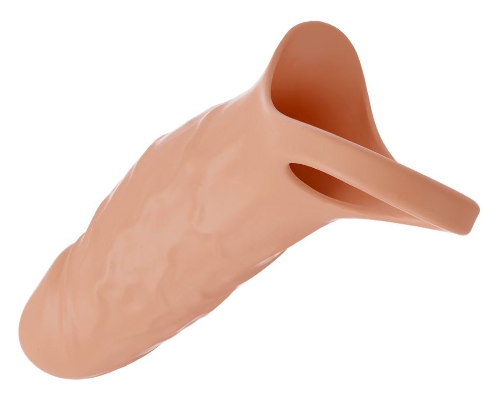 Manicotto fallico color carne con anello per testicoli. Formato per l'allungamento del pene. Superficie liscia.