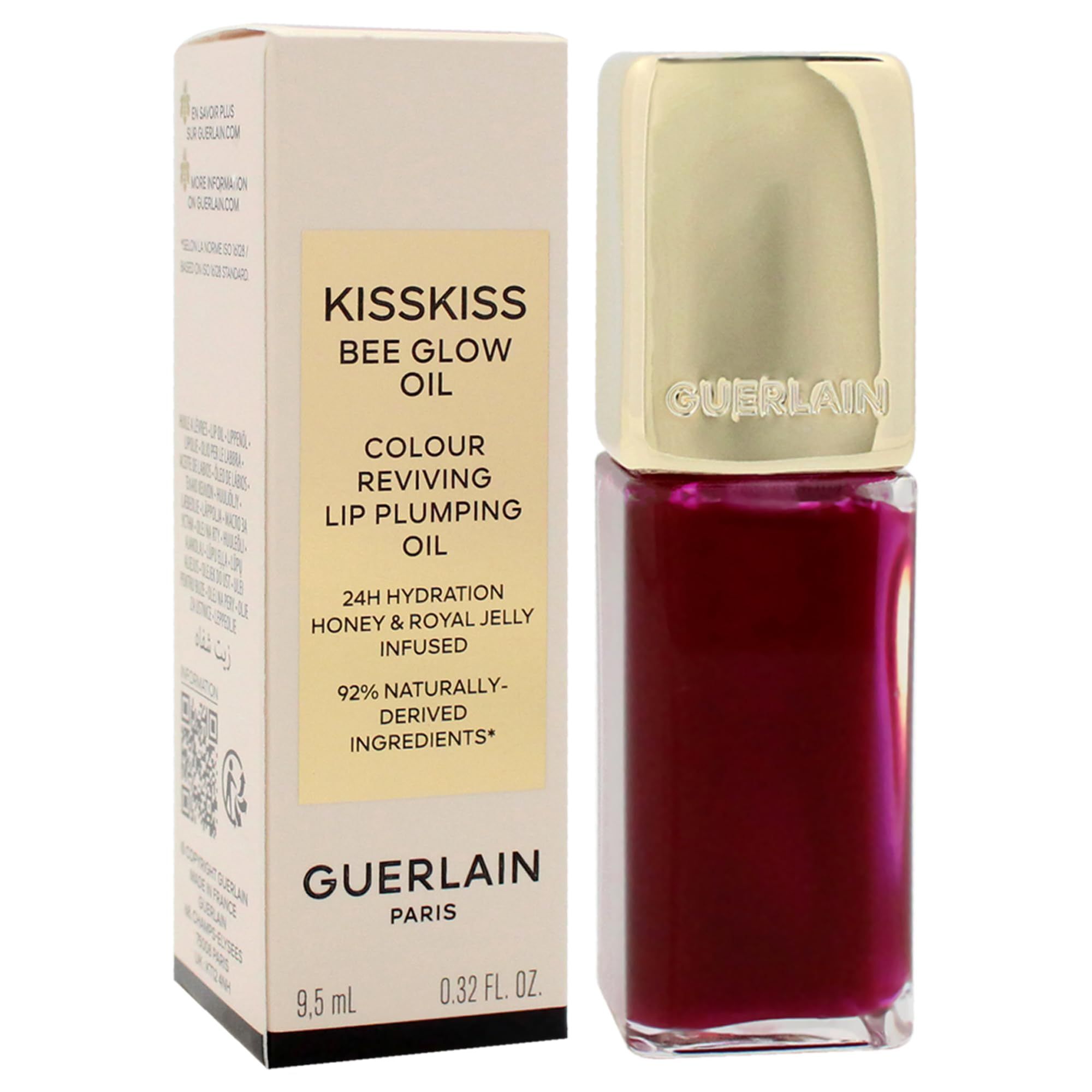 Olio per labbra e confezione. Sulla confezione c'è scritto "KISSKISS BEE GLOW OIL" e "GUERLAIN PARIS".