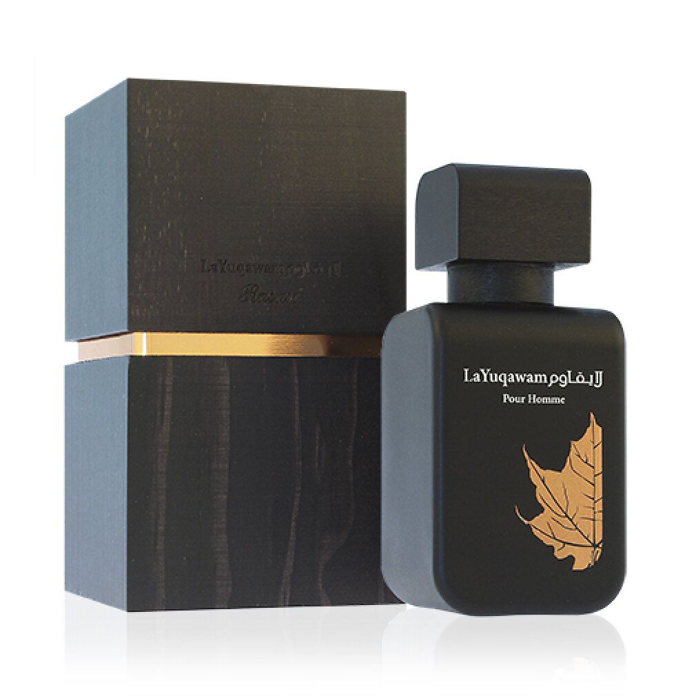 Flacone e confezione neri. Scritta La Yuqawam Pour Homme. Design a foglia. Effetto legno.