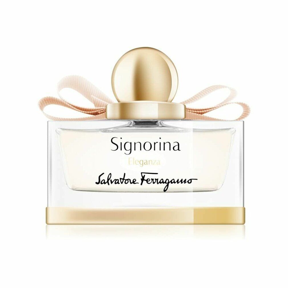 Flacone di profumo con fiocco e tappo. Scritta Signorina Eleganza e Salvatore Ferragamo. Dettagli dorati.