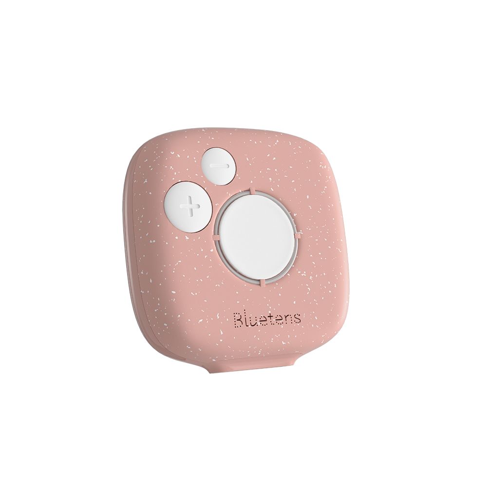 Dispositivo Pinktens rosa con un pulsante e due pulsanti più su sfondo maculato.