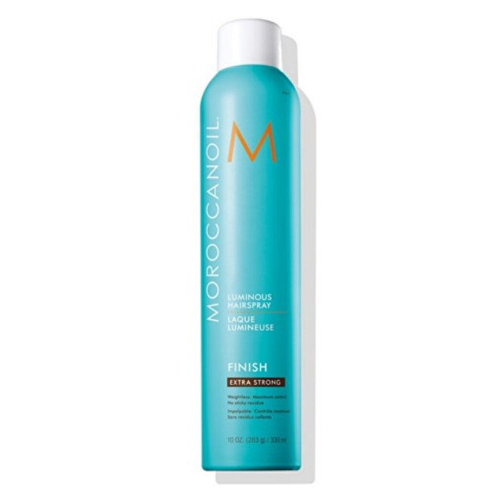 Flacone spray per capelli turchese con tappo bianco. Scritta: Luminous Haarspray, Extra Strong. Marchio: Moroccanoil.