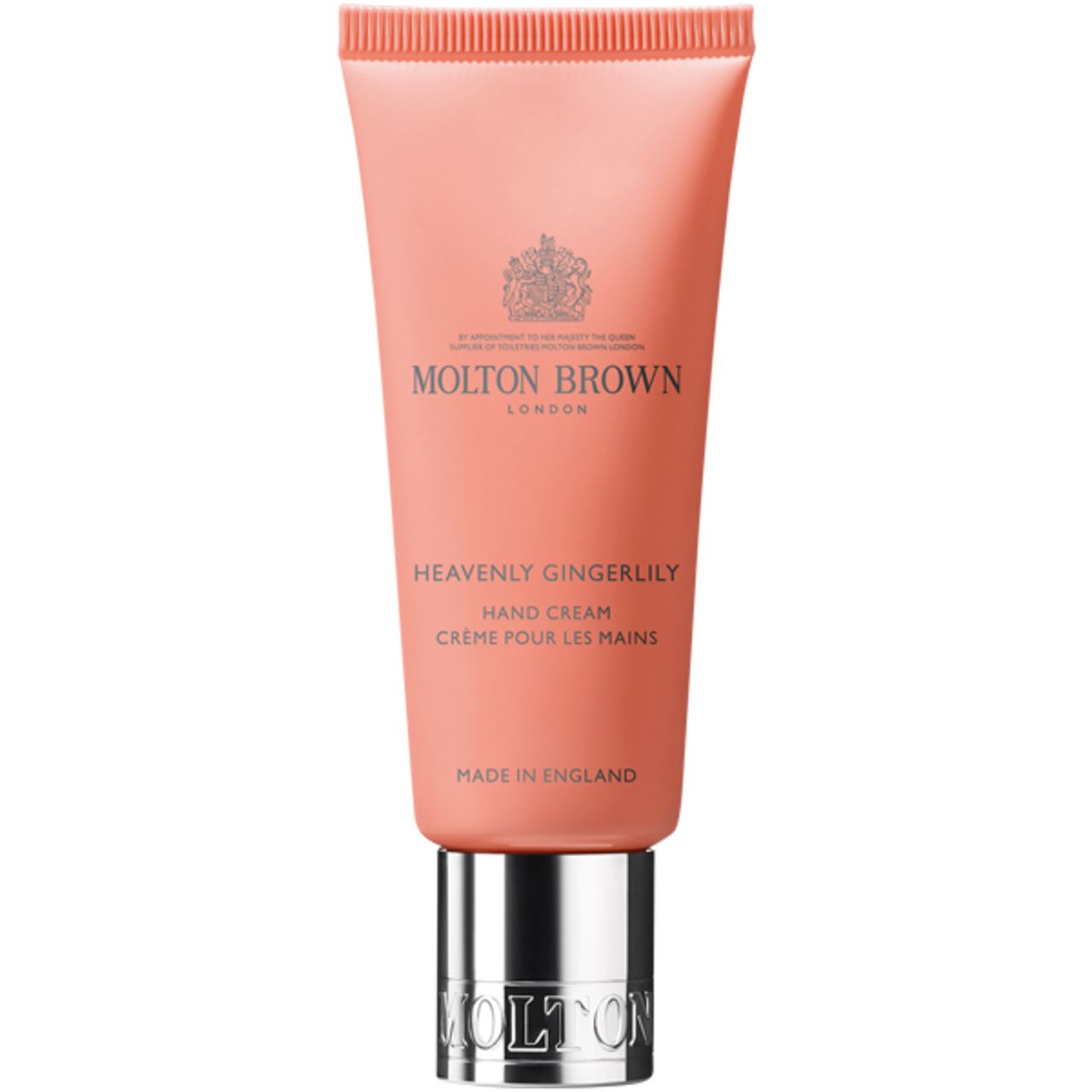Tubo di crema mani rosa con tappo argentato. Scritta: Molton Brown, Heavenly Gingerlily Hand Creme.