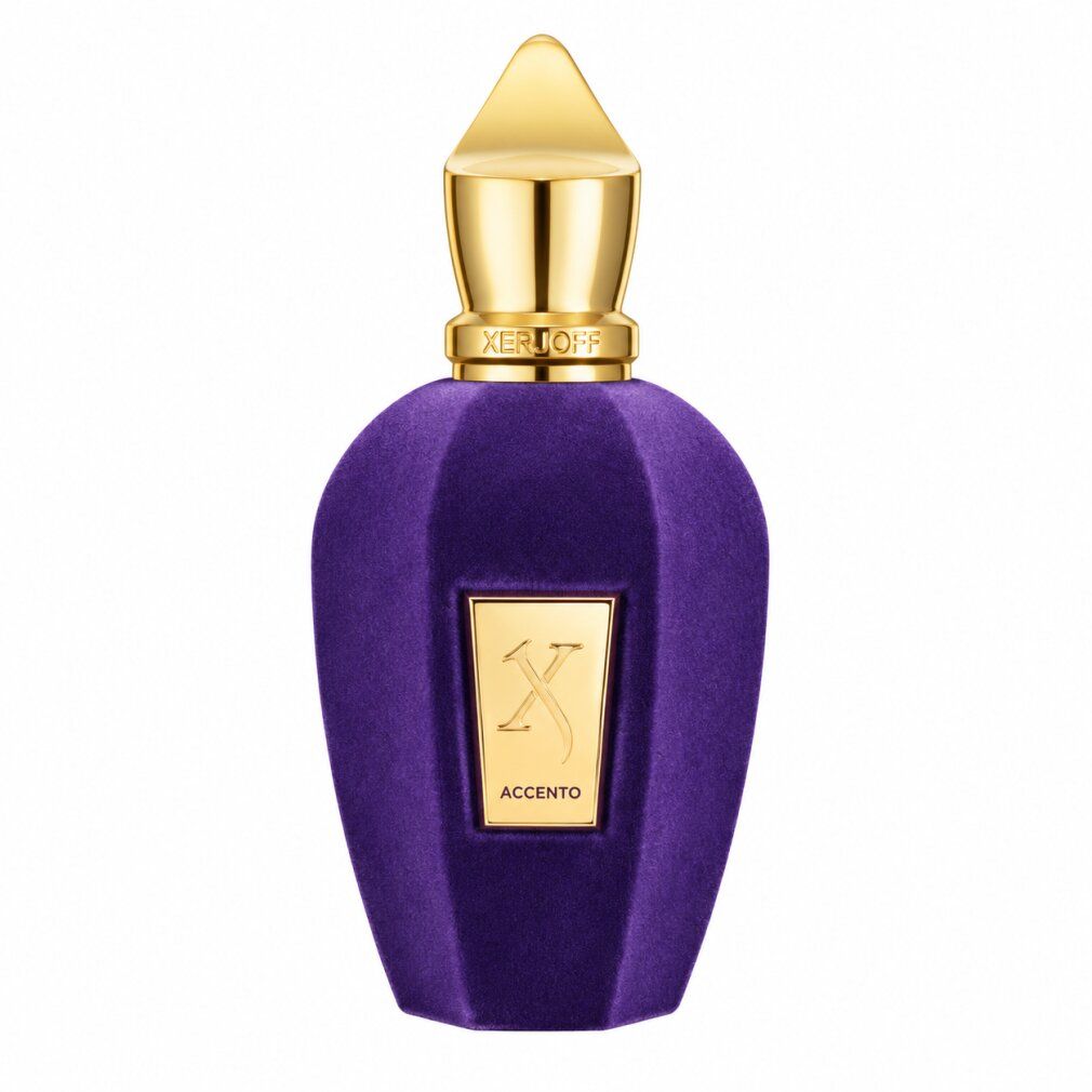 Flacone di profumo viola con tappo ed etichetta dorati.