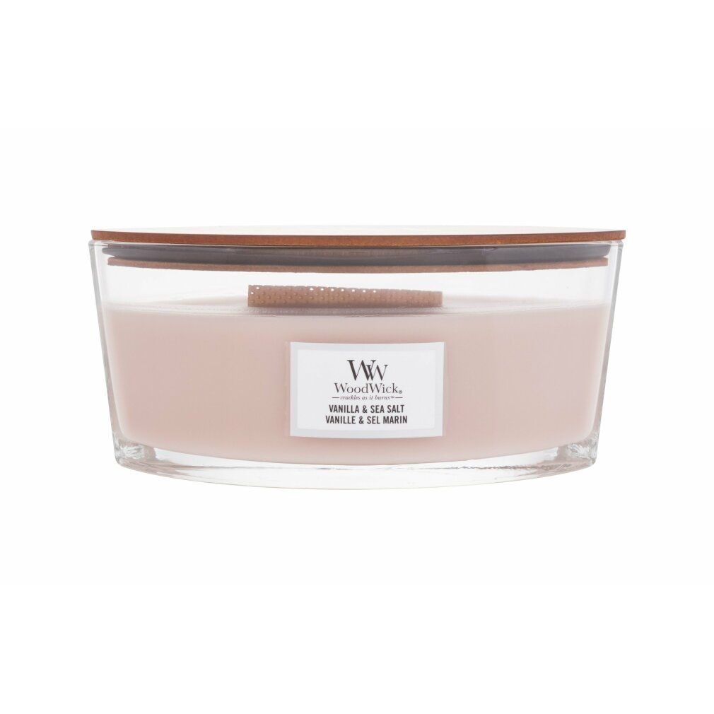 Candela Ellipse con coperchio. Contenitore in vetro, cera color crema. Etichetta 'Vanilla & Sea Salt'.