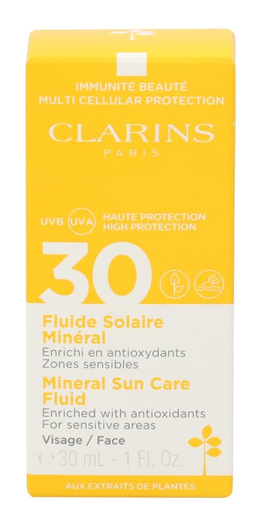 Confezione gialla con scritta: Clarins, 30, Fluide Solaire Minéral, Mineral Sun Care Fluid. Per pelli sensibili. Logo sole.