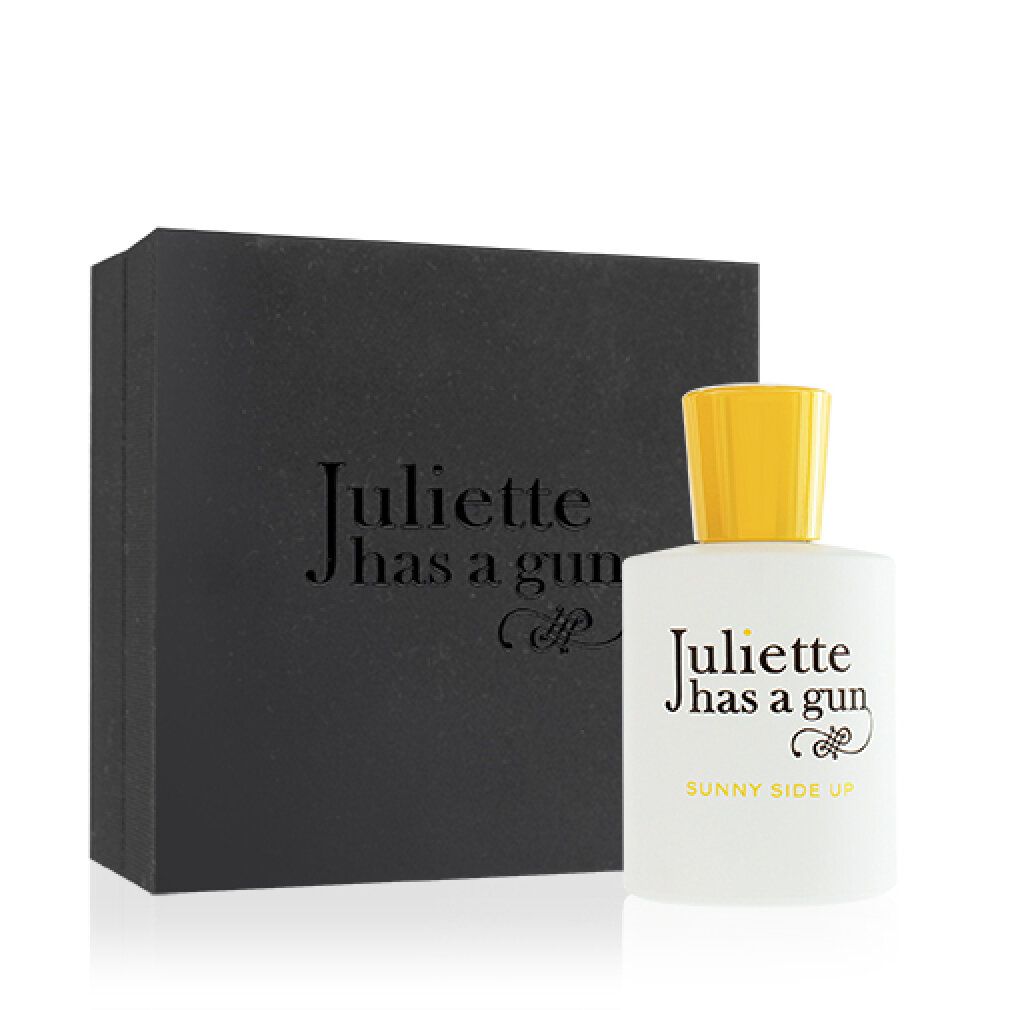 Flacone bianco con tappo giallo e confezione nera. Scritta: Juliette has a gun Sunny Side Up.
