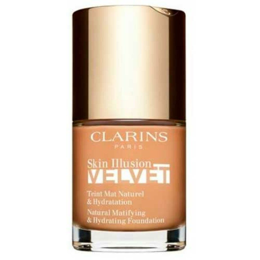 Fondotinta liquido in flacone di vetro con tappo dorato. Scritte: CLARINS, Skin Illusion Velvet, Teint Mat Naturel & Hydratation.