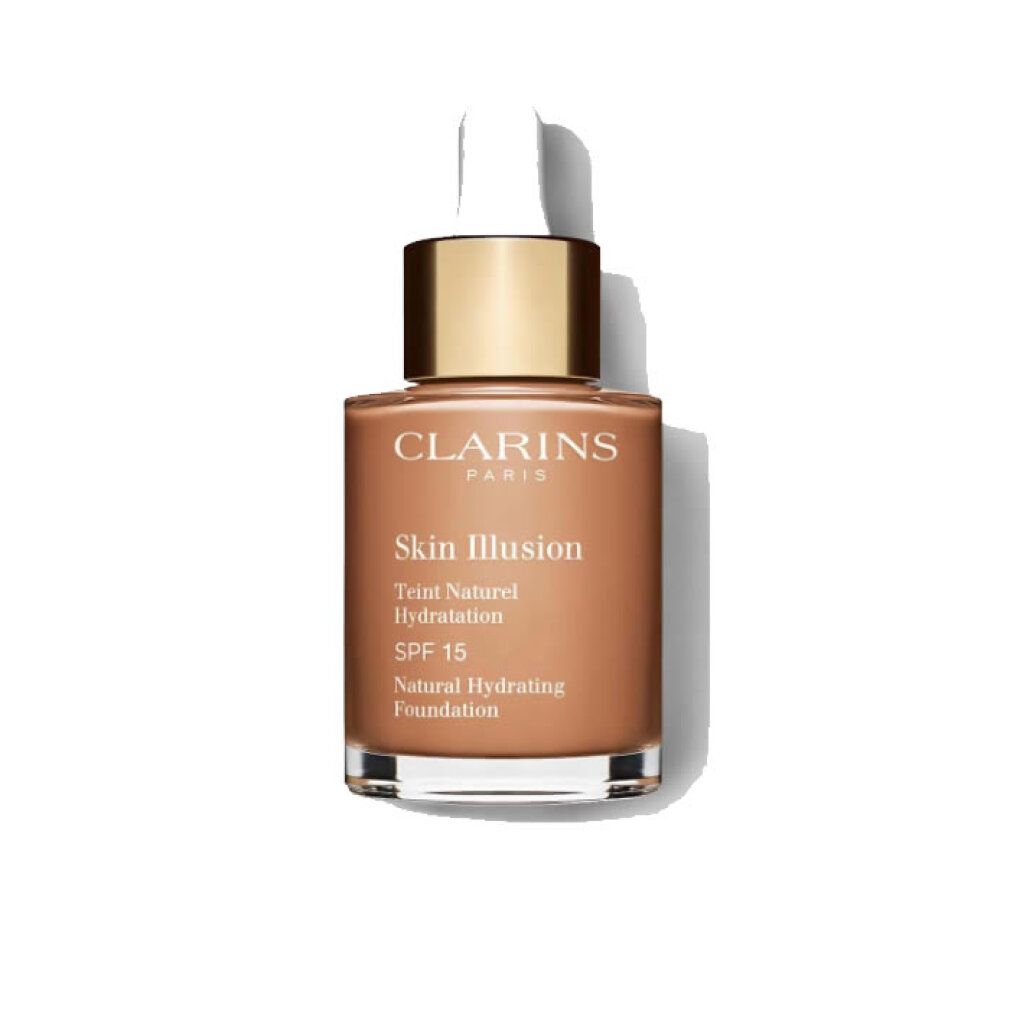 Fondotinta Clarins Skin Illusion. Liquido marrone in flacone di vetro con tappo dorato e pipetta. SPF 15.