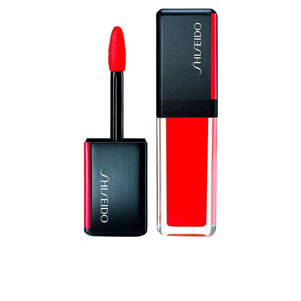 Rossetto SHISEIDO con tappo nero e dettaglio rosso. Applicatore visibile. Rossetto aperto.