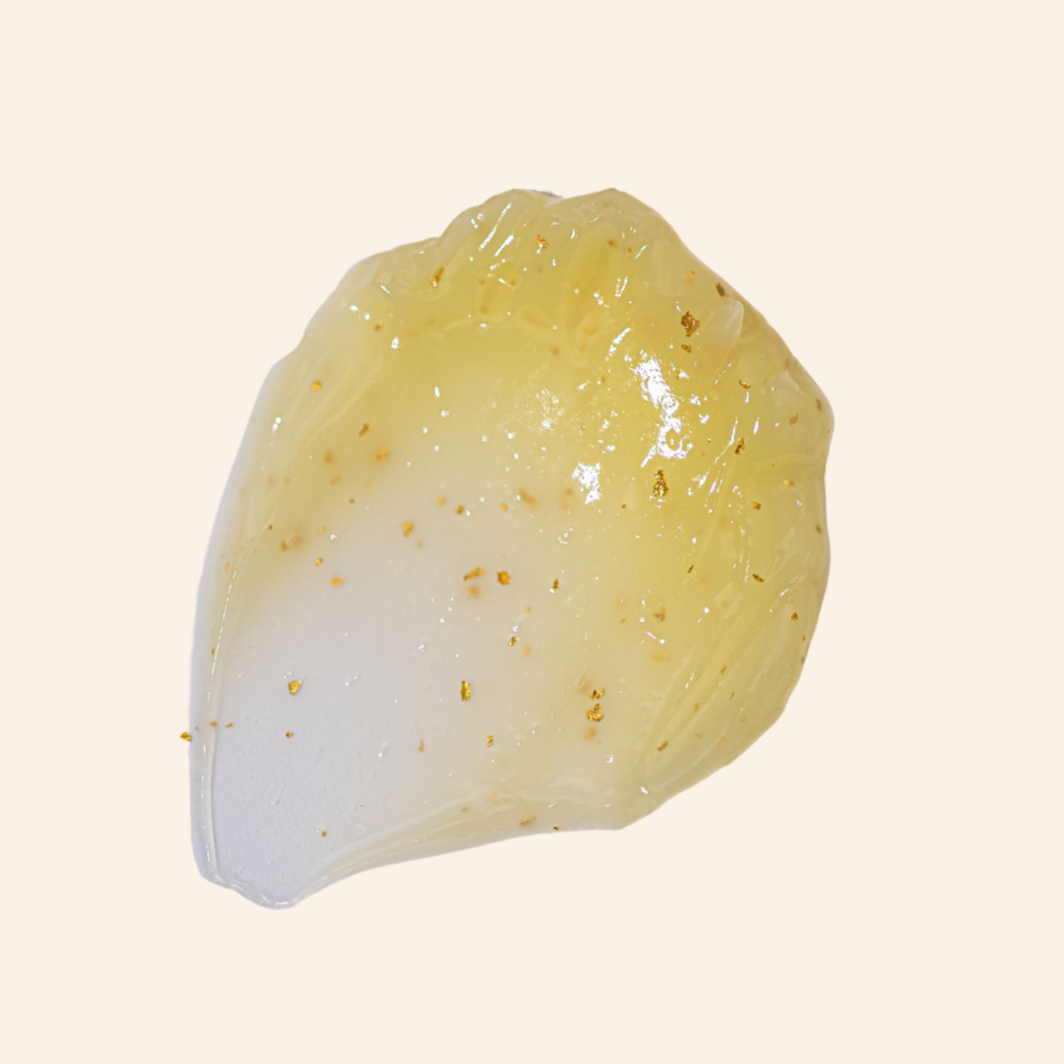 Sostanza gelatinosa con particelle dorate. Testo: Acido ascorbico, Squalane, Arginina, Glutatione, Caffeina.