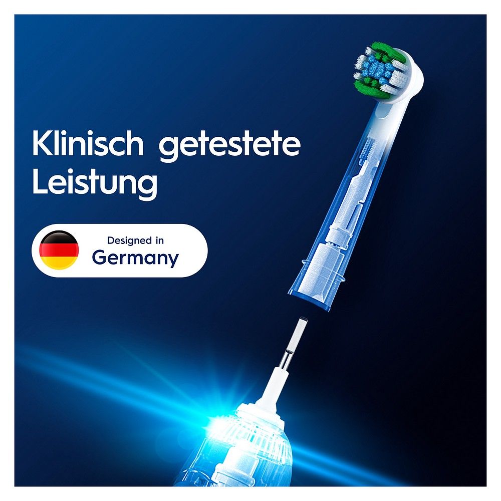Testina dello spazzolino con manico trasparente e setole verdi/blu. "Designed in Germany".