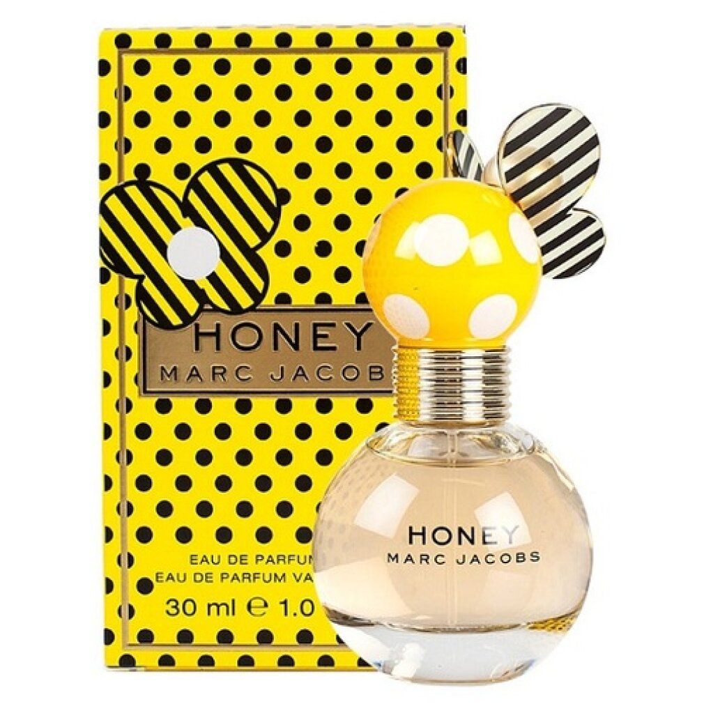 Scatola gialla a pois neri e flacone. Flacone con corpo giallo, pois bianchi e collo dorato. "HONEY" e "MARC JACOBS".