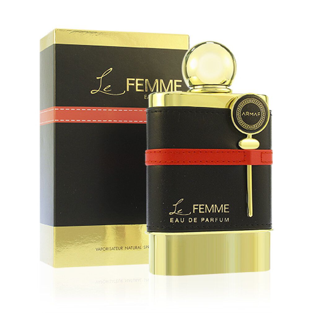 Flacone dorato con fascia in pelle nera e striscia rossa. Confezione nera con scritta dorata. Scritta: Le Femme.