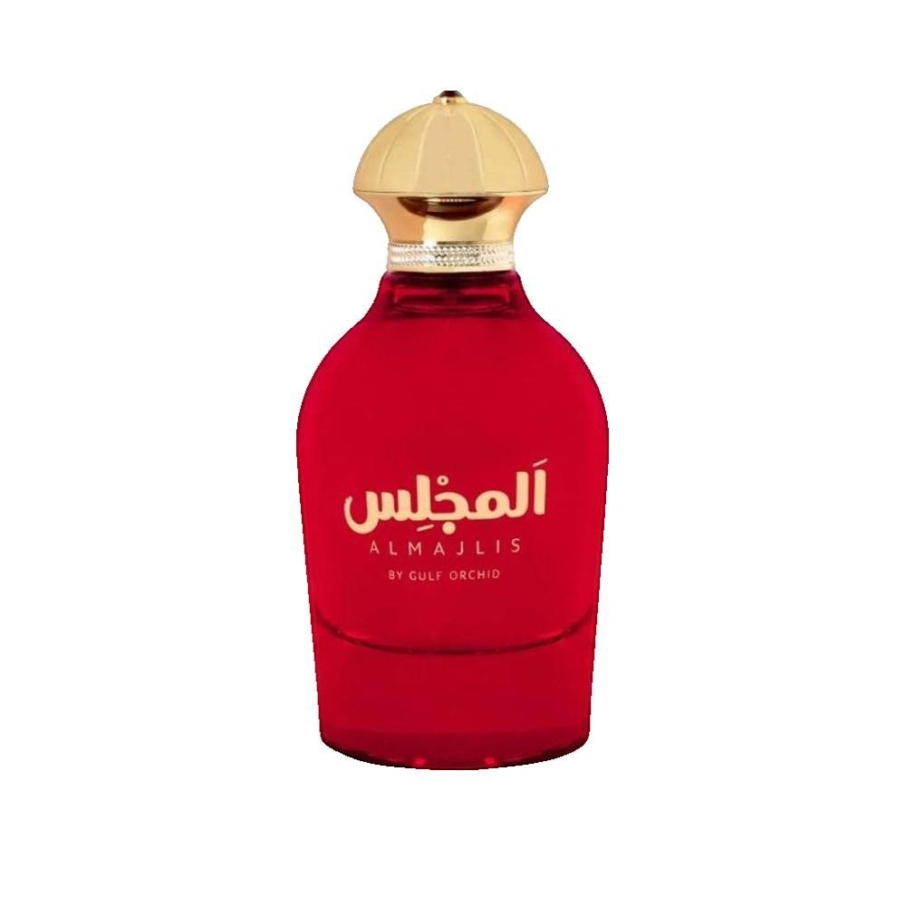 Flacone di profumo rosso con tappo dorato. Scritta araba e testo inglese.