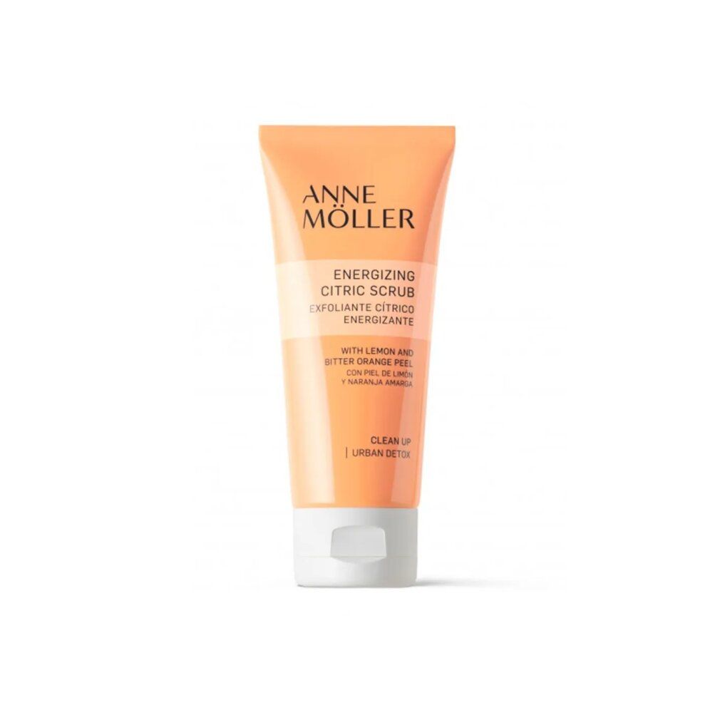 Tubo arancione con tappo bianco. Scritta: Anne Möller, Energizing Citric Scrub. Con scorza di limone e arancia amara.