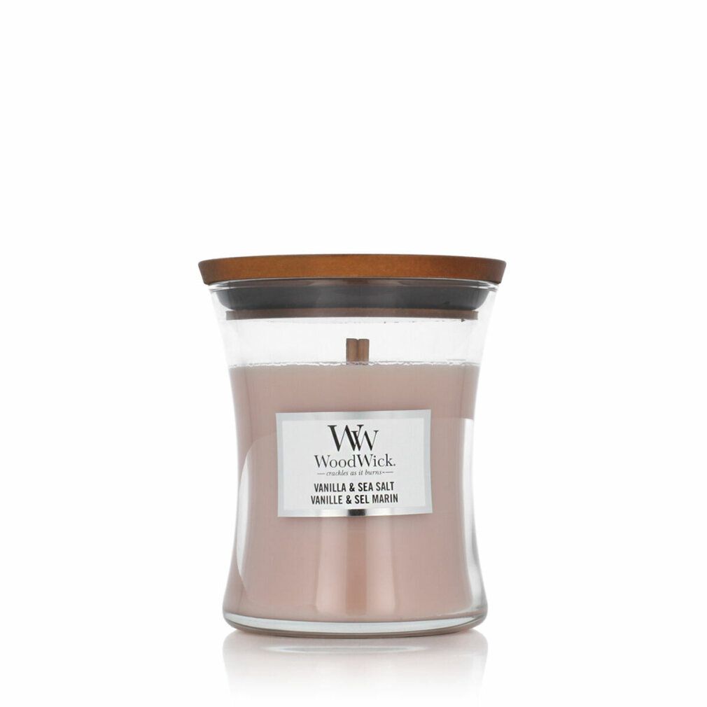 Candela a clessidra con coperchio. Etichetta "WoodWick Vanilla & Sea Salt".