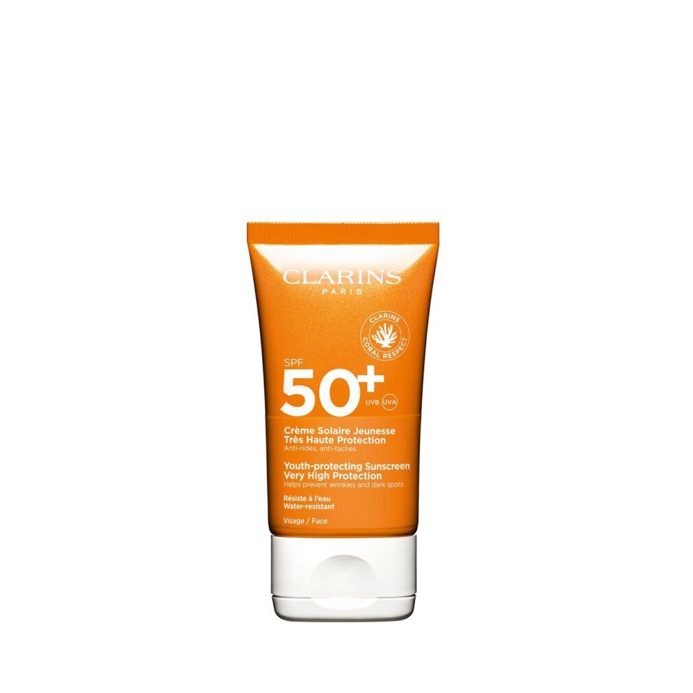 Tubo arancione e bianco. Testo: Clarins Paris, SPF 50+, Crème Solaire Jeunesse, Très Haute Protection, Anti-rughe, anti-macchie.