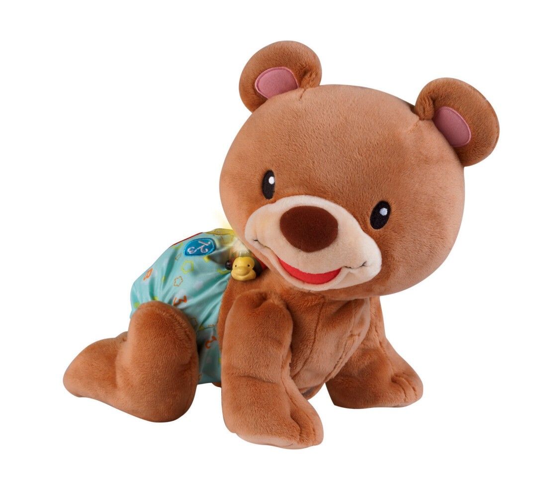 Orso marrone che gattona con pannolino blu. Accessorio giallo al collo. Orecchie e naso rosa. Occhi e bocca dipinti.