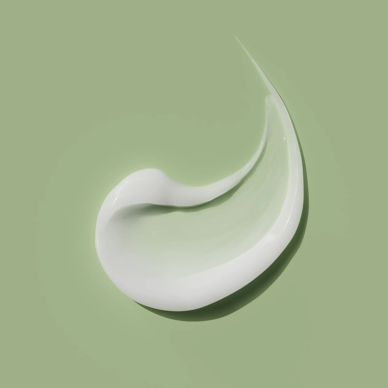 Prodotto bianco su sfondo verde. Modello di crema.