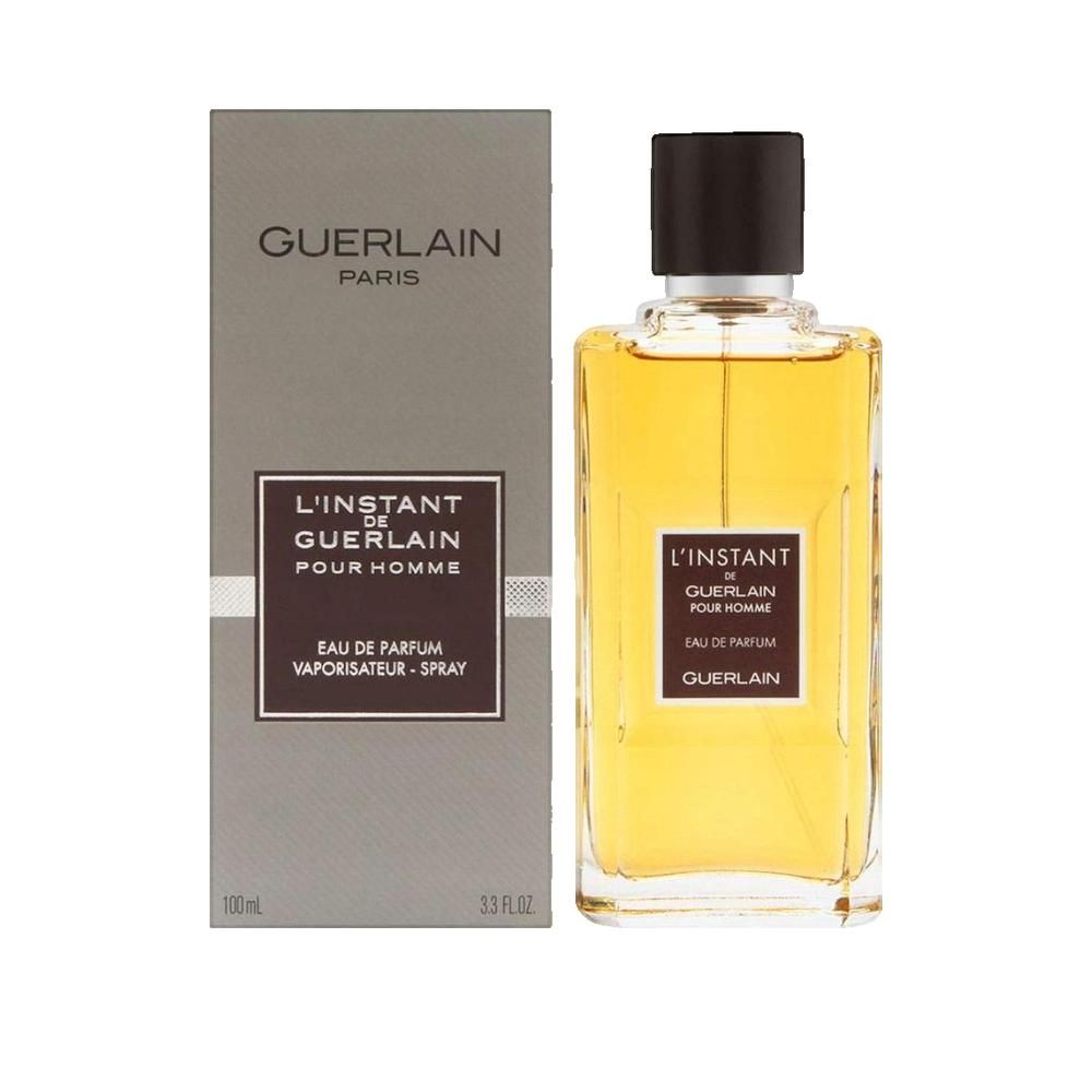 Flacone e confezione Guerlain L'Instant de Guerlain pour Homme Eau de Parfum. Bottiglia rettangolare, confezione grigia.