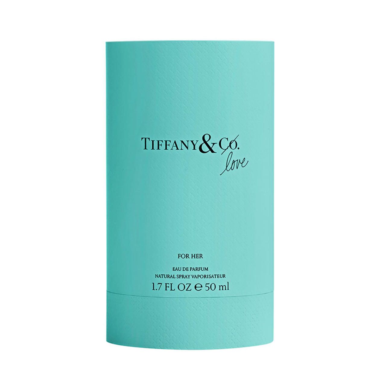 Confezione cilindrica turchese di Tiffany & Co. Love Eau de Parfum. Scritta nera, sfondo bianco.