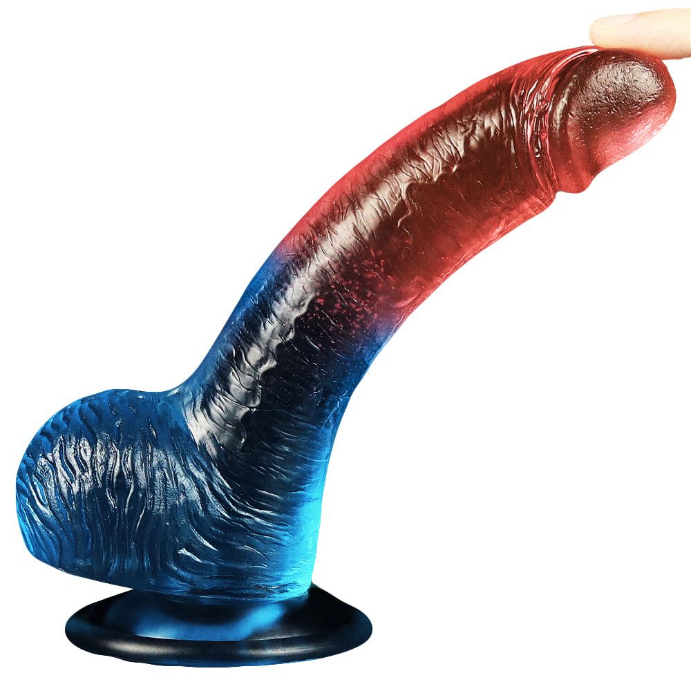 Dildo bicolore. Testa rossa, corpo blu con base. Superficie scanalata.