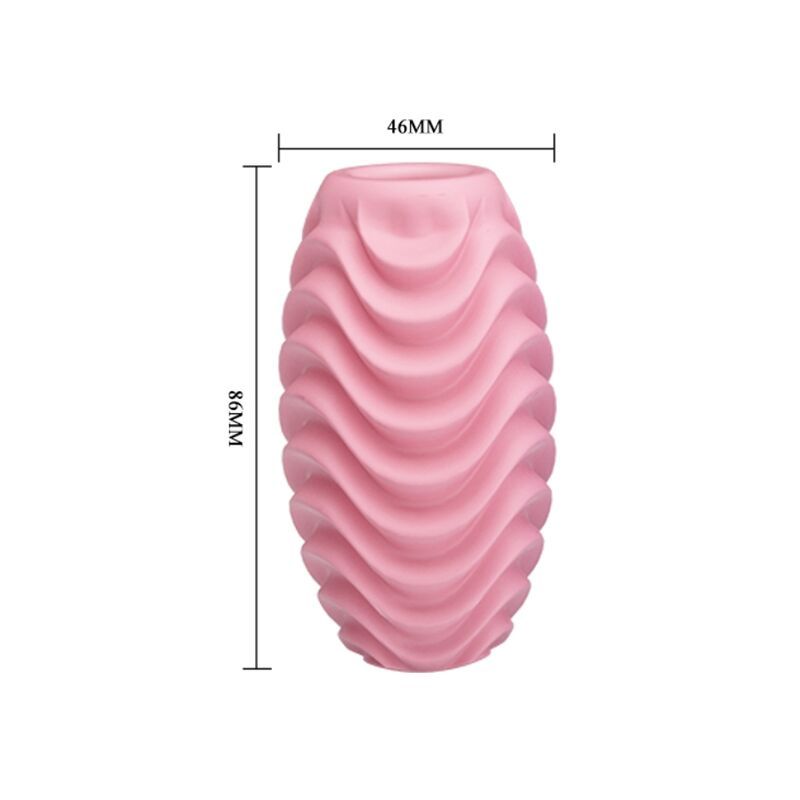 Uovo da masturbazione rosa, dimensioni 86mm x 46mm, con motivo a onde.